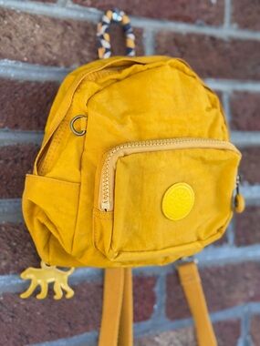 Kipling Mini Backpack in Mustard.  Yellow.  EUC.